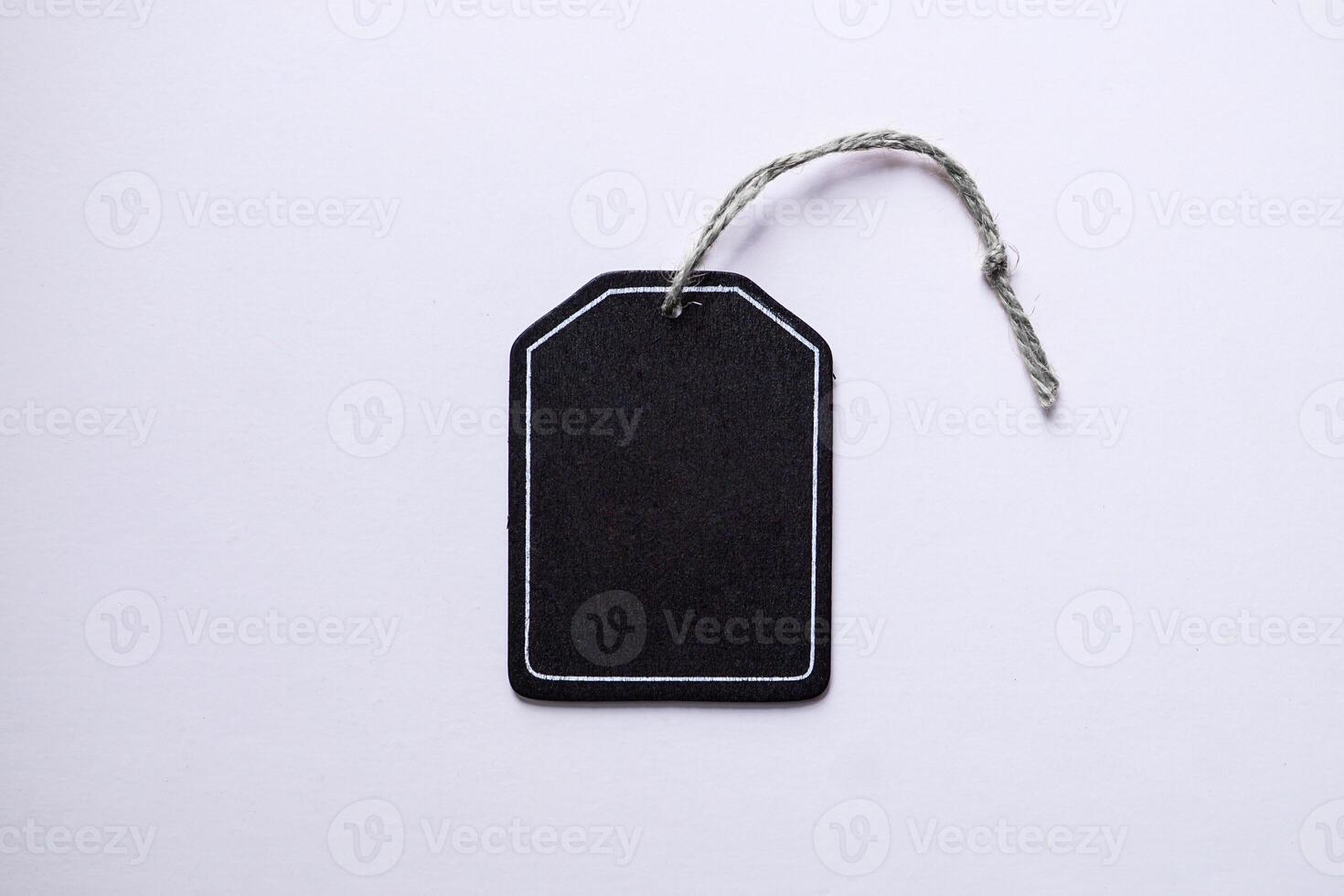 black price tag on the white background, black mockup photo