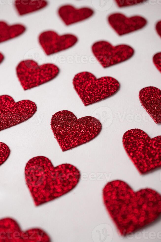 Red heart shapes on the white background in valentine's day photo