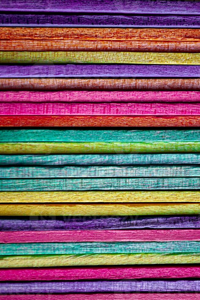 multi colored wooden craft sticks, colorful background photo