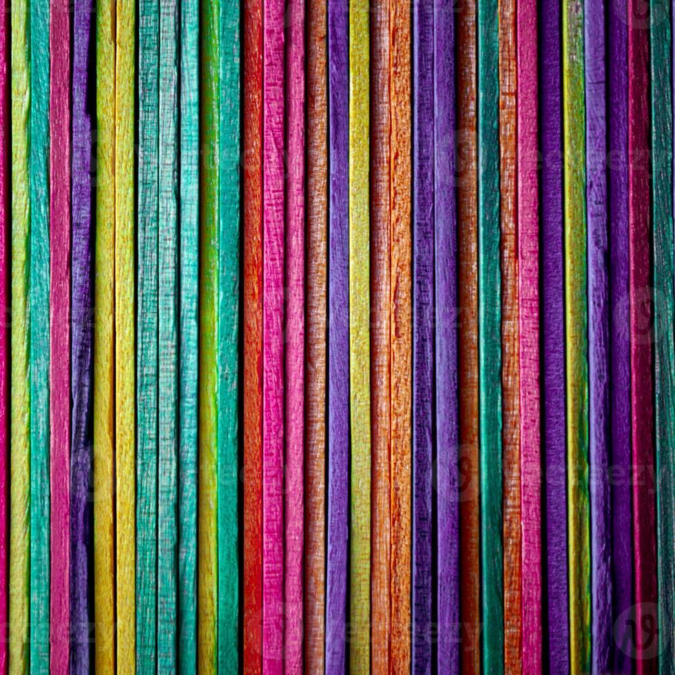 multi colored wooden craft sticks, colorful background photo