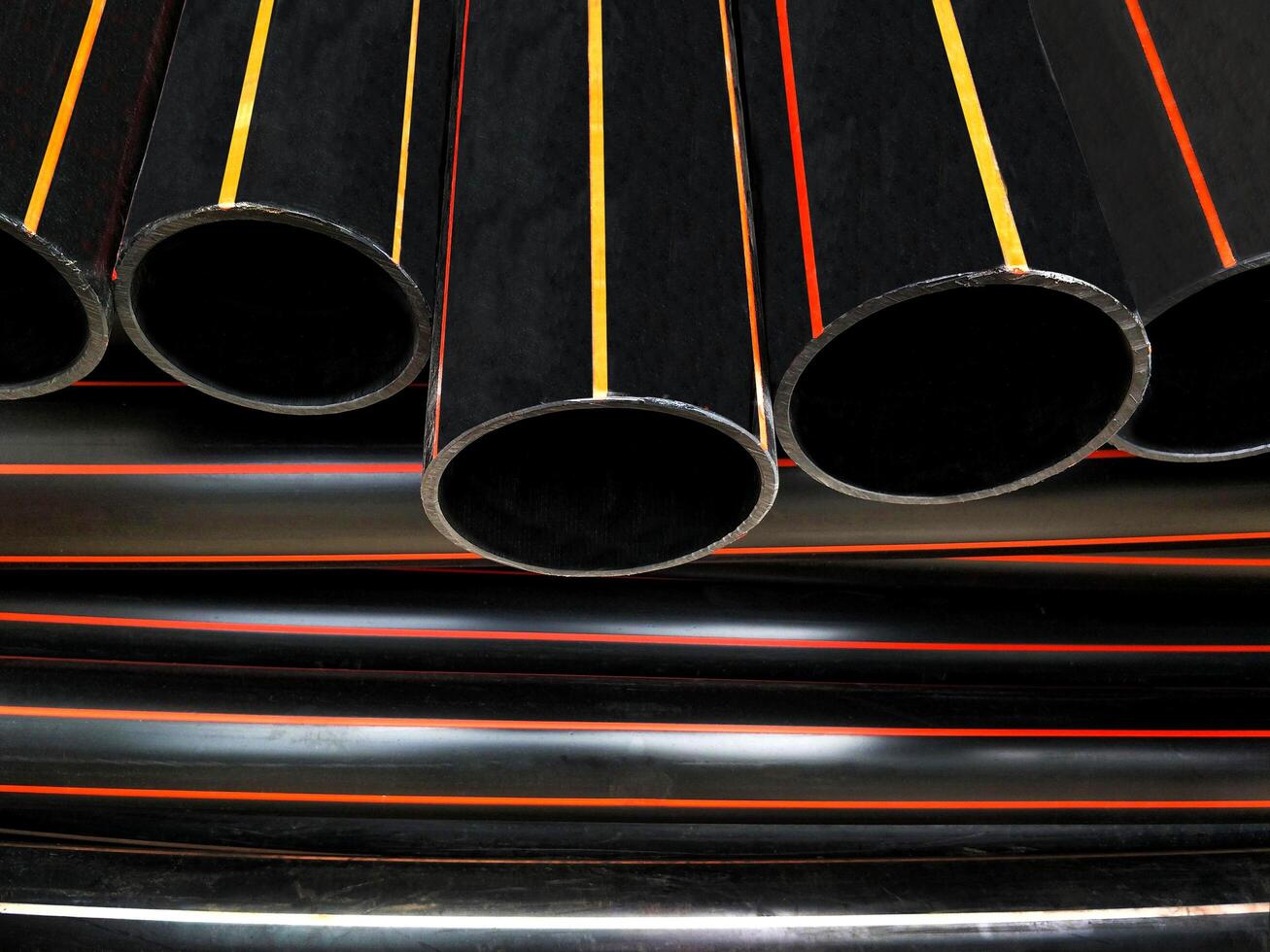 Pile of HDPE pipes conduit for underground electrical wiring installation photo