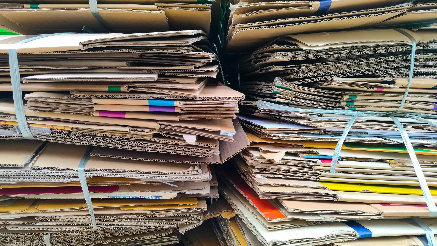 Recyclable Material Background, Pile of the old used Cardboard Boxes Bundles for Recycling photo
