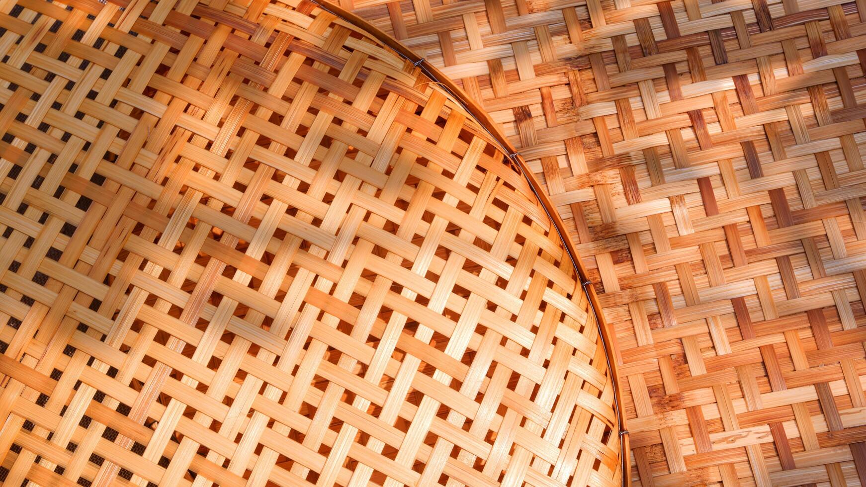 Two bamboo threshing baskets texture background with sunlight and shadow on surface, top view with copy space photo
