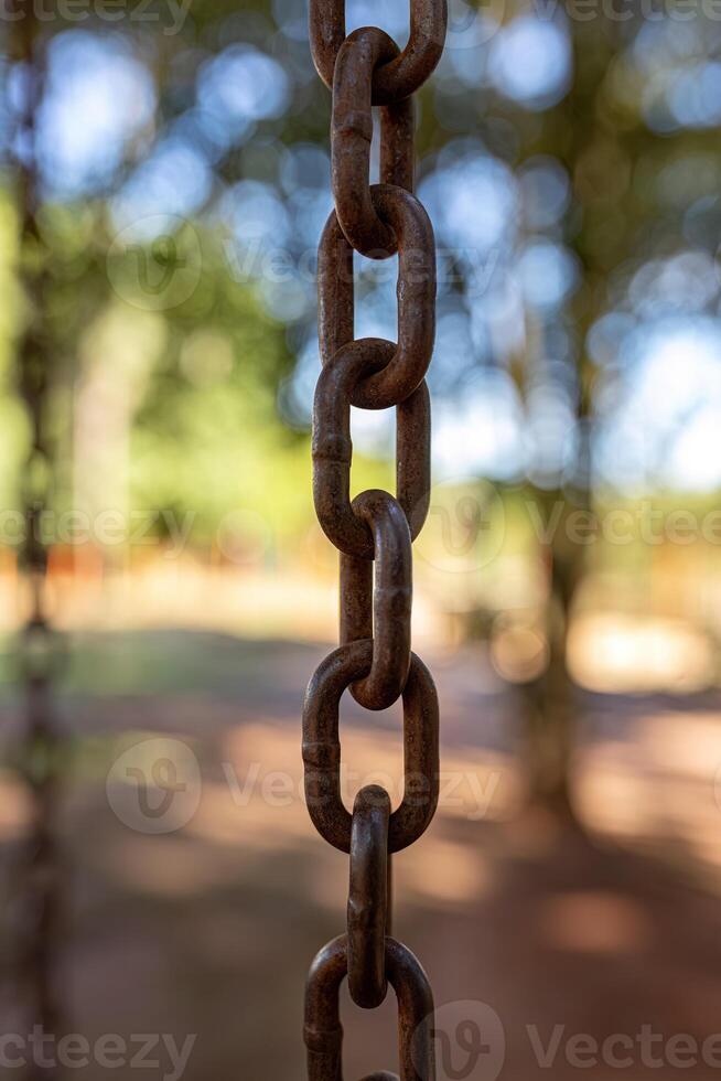 swing steel chain suspended in playground photo