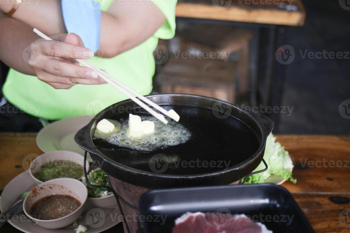 boiling butter on hot pan prepare for eating Thai barbecue buffet photo