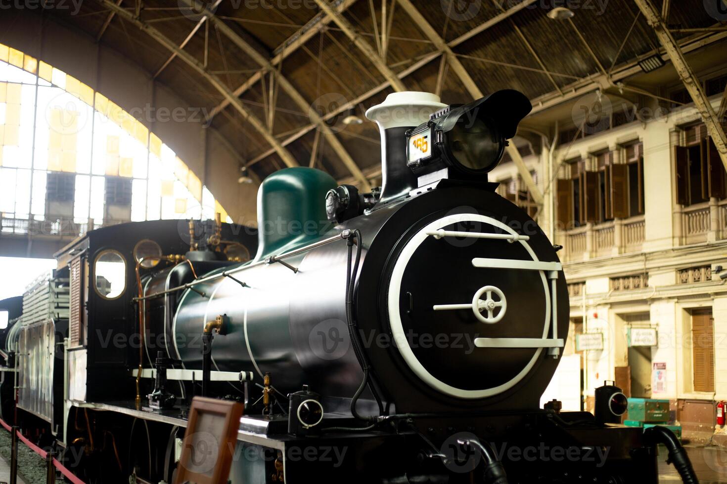 old locomotive in the depot train railway station museum with sun light pass through photo