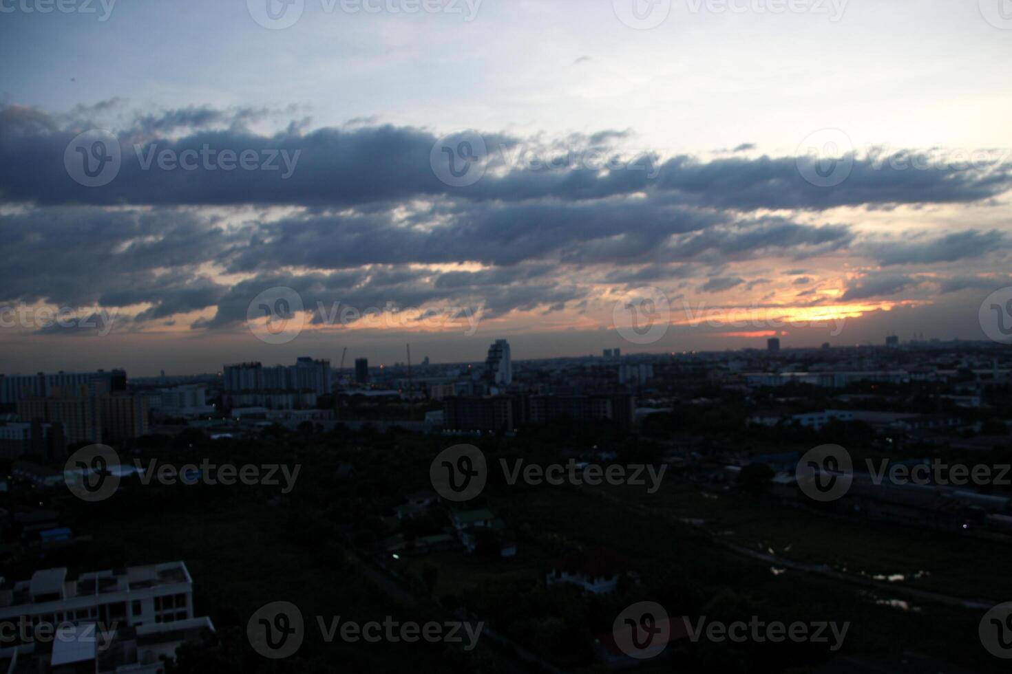 heaven cloudy sky day evening dusk time with sunlight ray from between clouds with city town background photo