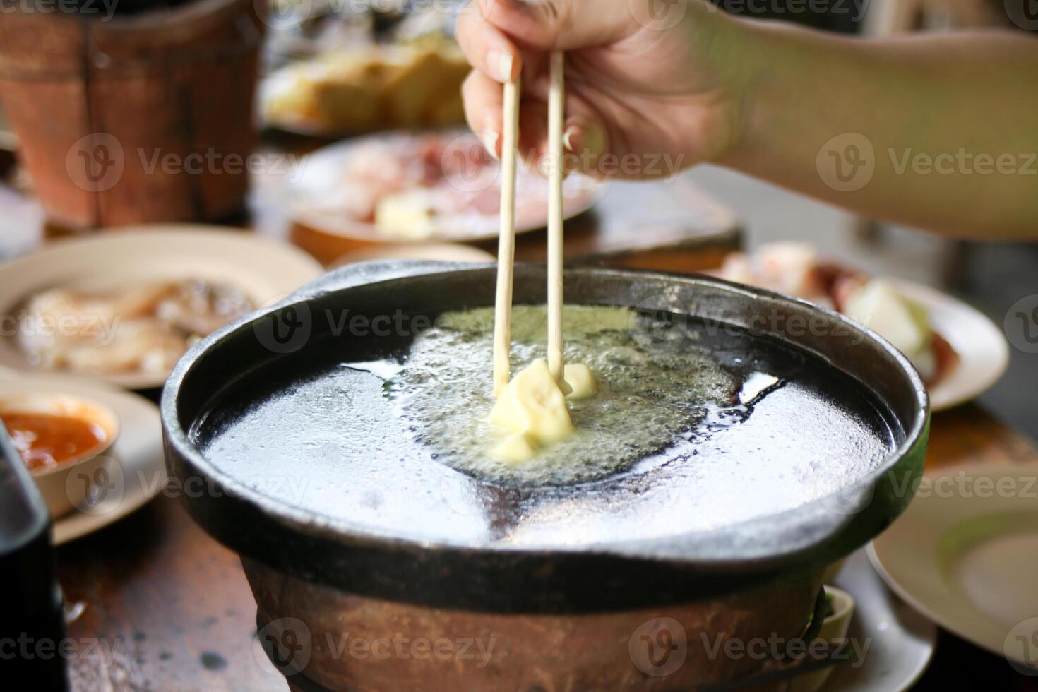 boiling butter on hot pan prepare for eating Thai barbecue buffet photo