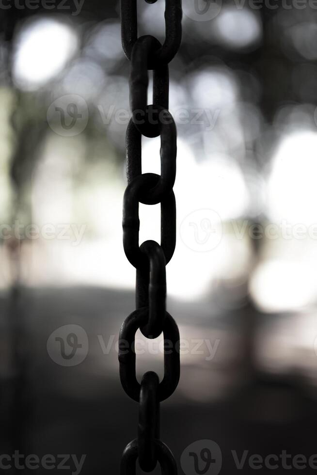 steel chain suspended in close up photo