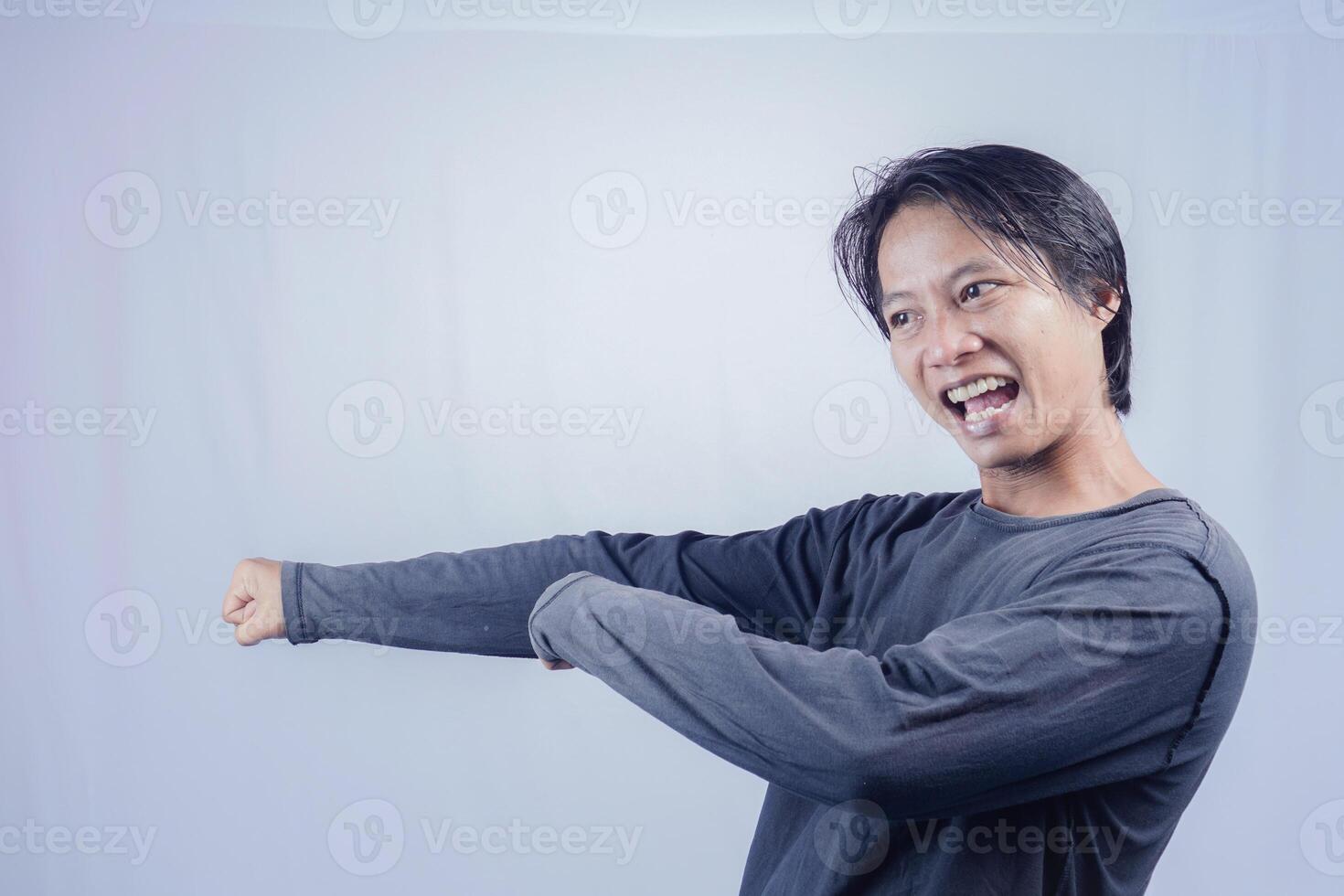 handsome asian man is excited with full force shouting and review, on isolated white background for copy space. photo