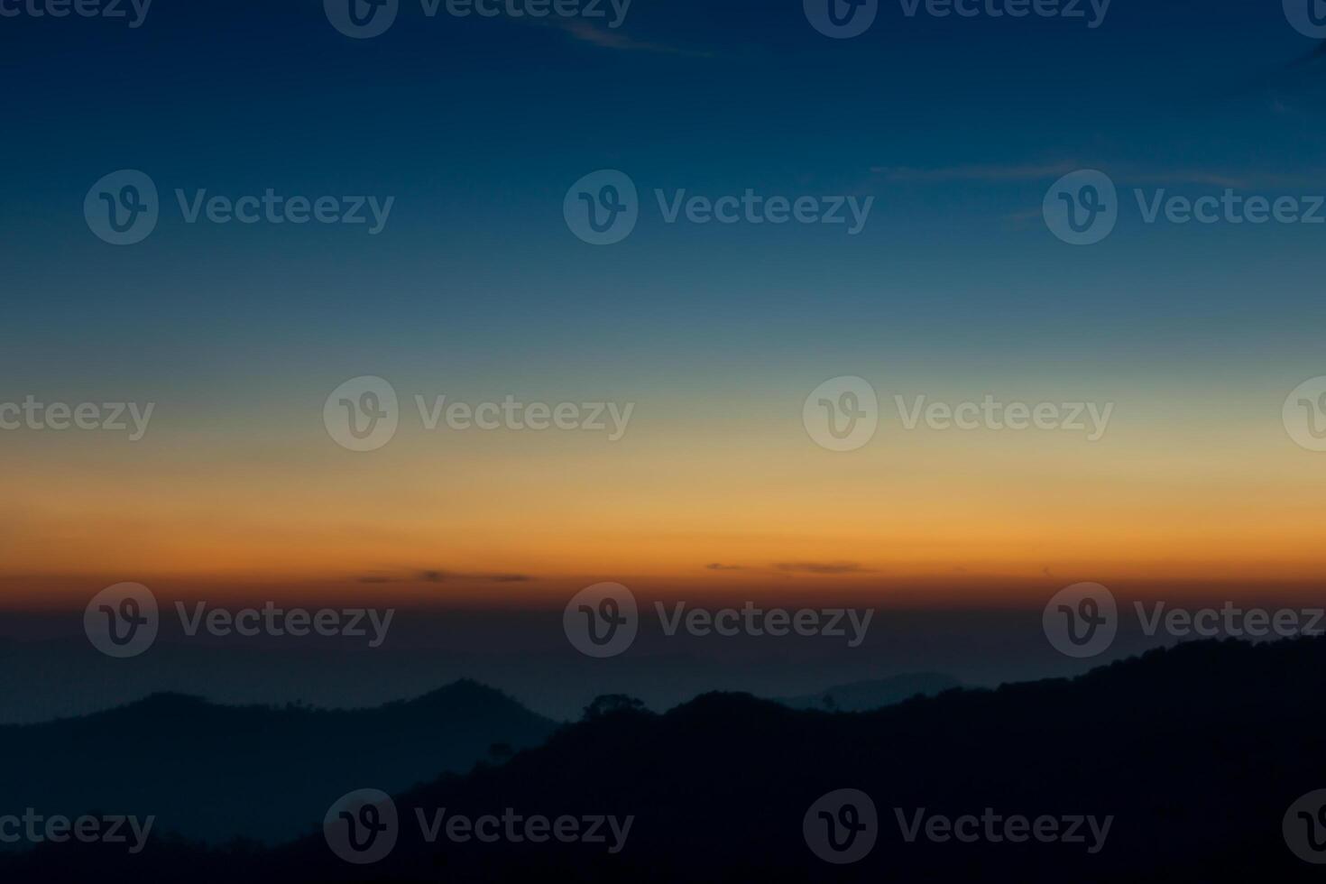 Silhouettes Mountain and Sky before sunrise photo