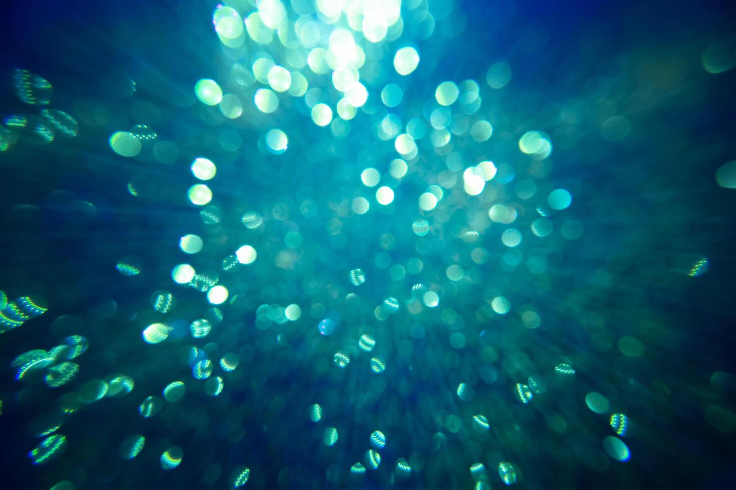 Sparkling glitter bokeh background with light. photo