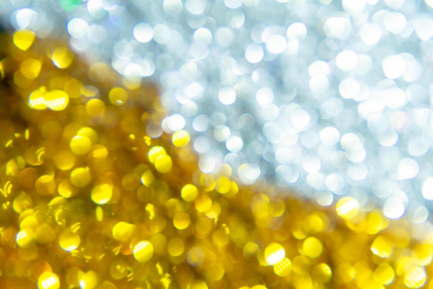 Silver and golden sparkling bokeh background. photo