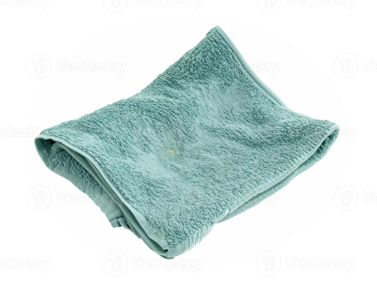 green towel isolated on white background photo