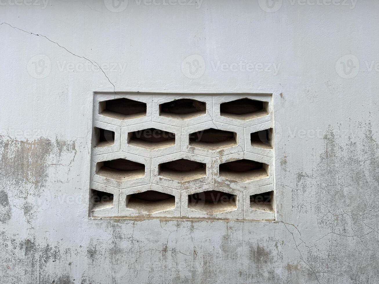 close up hole on cement wall photo