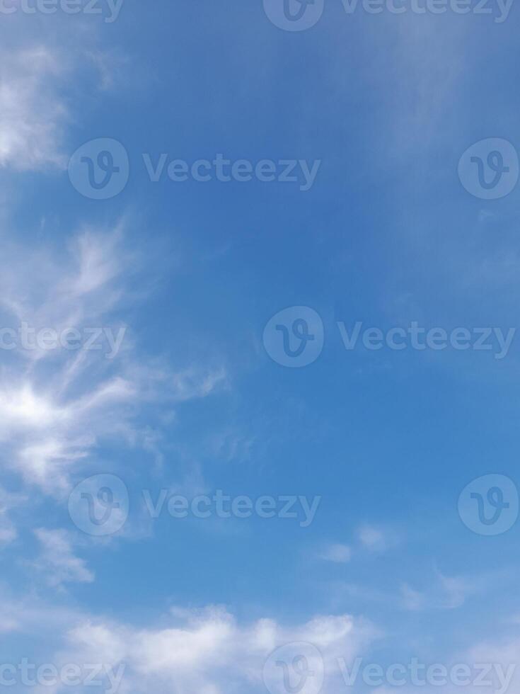 Beautiful white clouds on deep blue sky background. Large bright soft fluffy clouds are cover the entire blue sky. photo