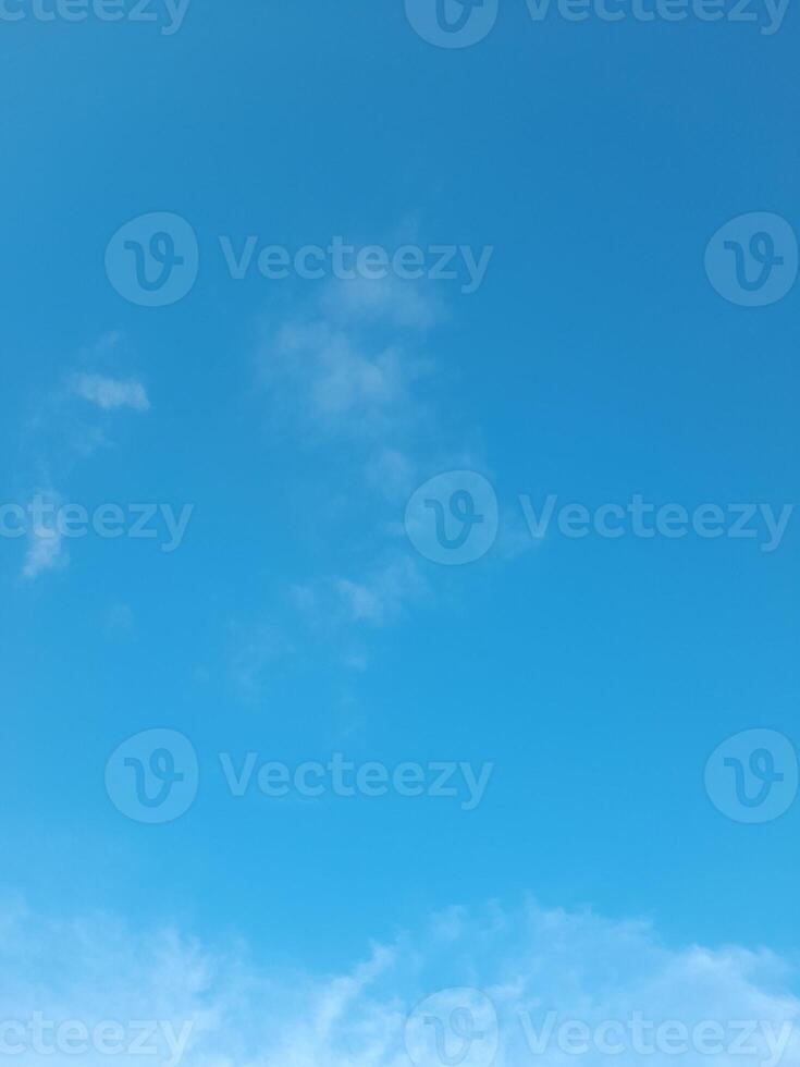 Beautiful white clouds on deep blue sky background. Large bright soft fluffy clouds are cover the entire blue sky. photo