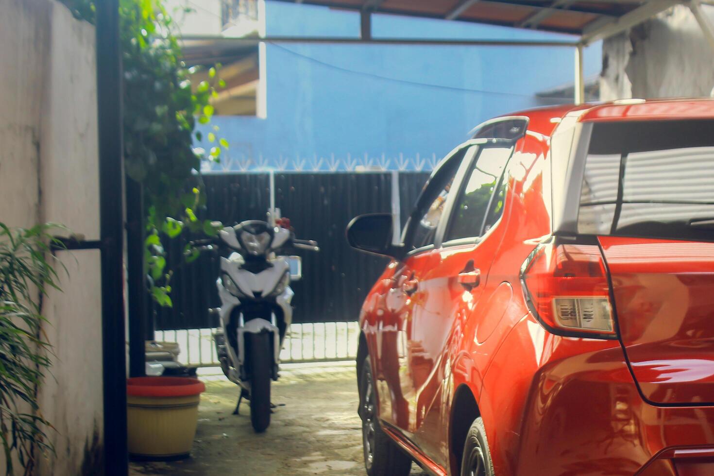 A red city car parked in the garage photo