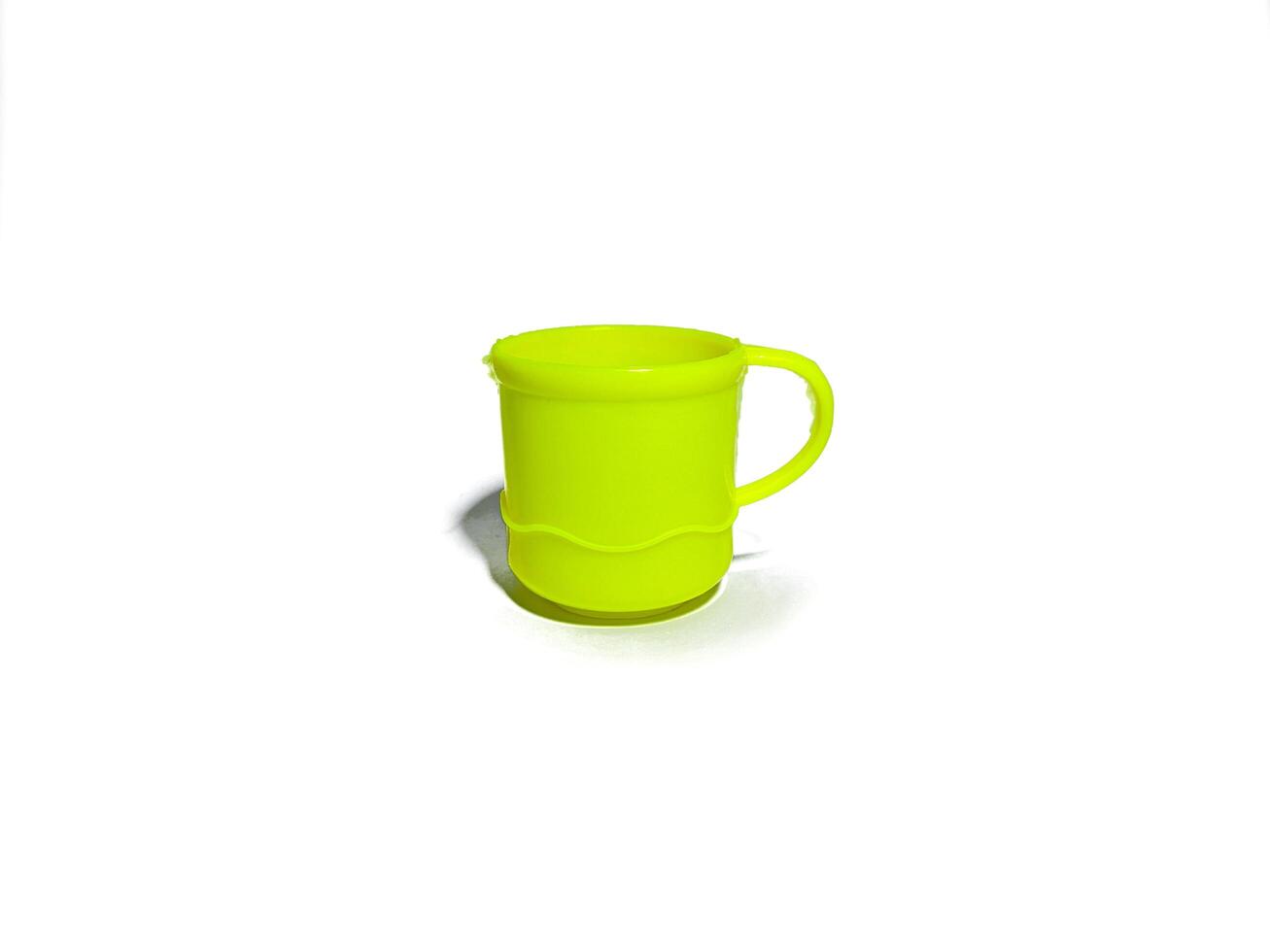 Isolated image yellow plastic cup. shot from the side photo