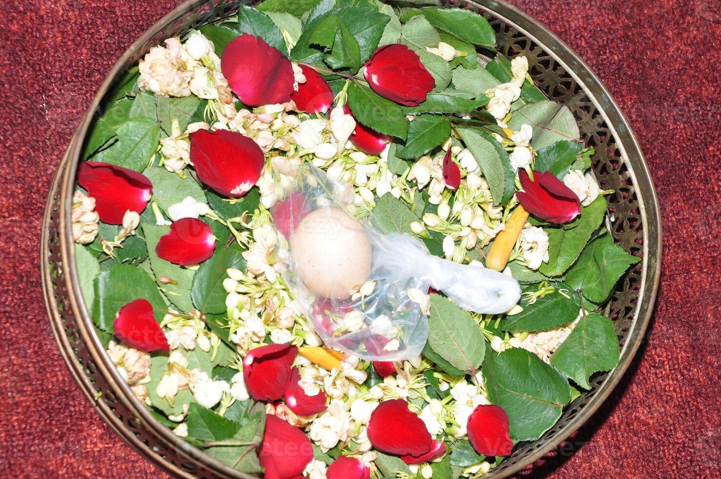 The procession is stepping on Javanese traditional wedding eggs photo