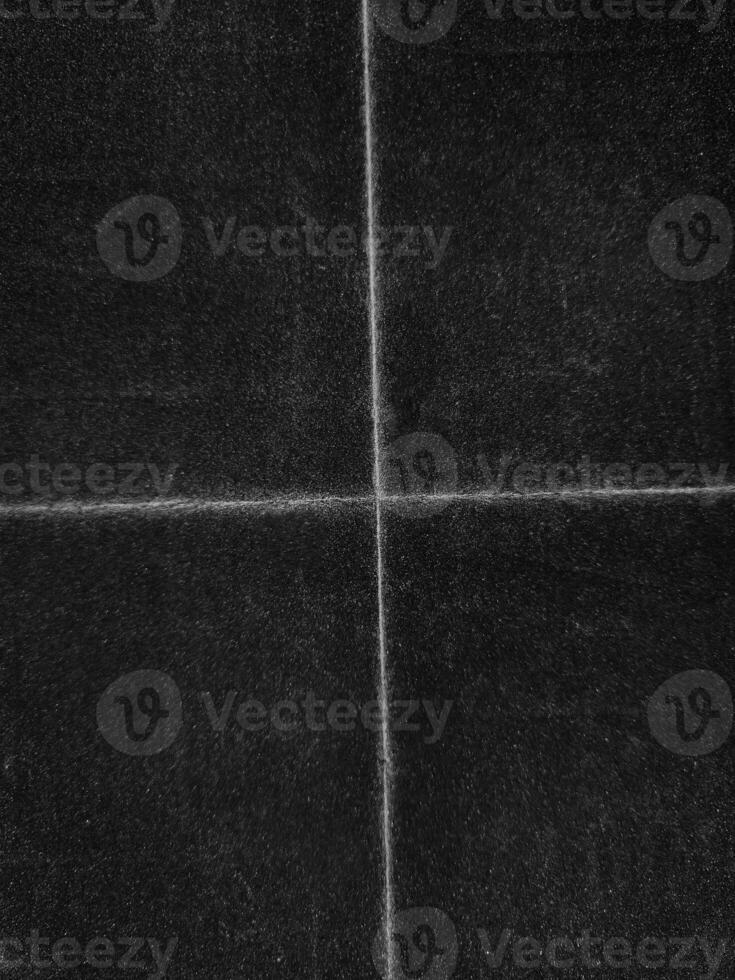 Beautiful Black grunge folded texture. Folded paper background with scratches and dust. Old folded paper texture for your design. photo