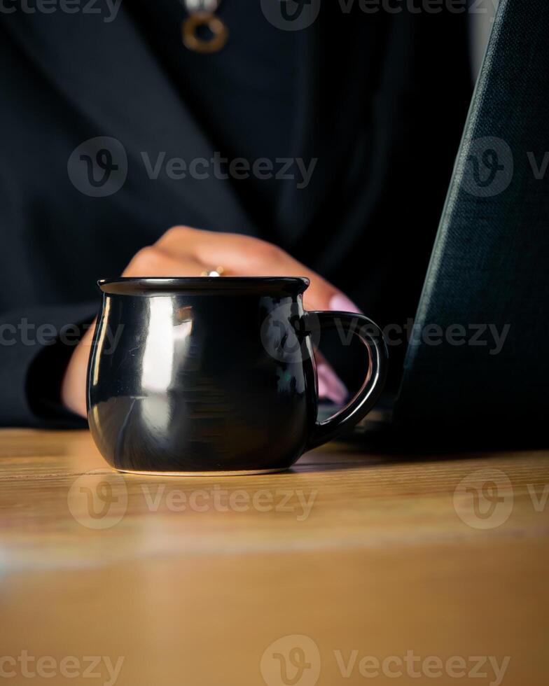 Young woman holding tea photo