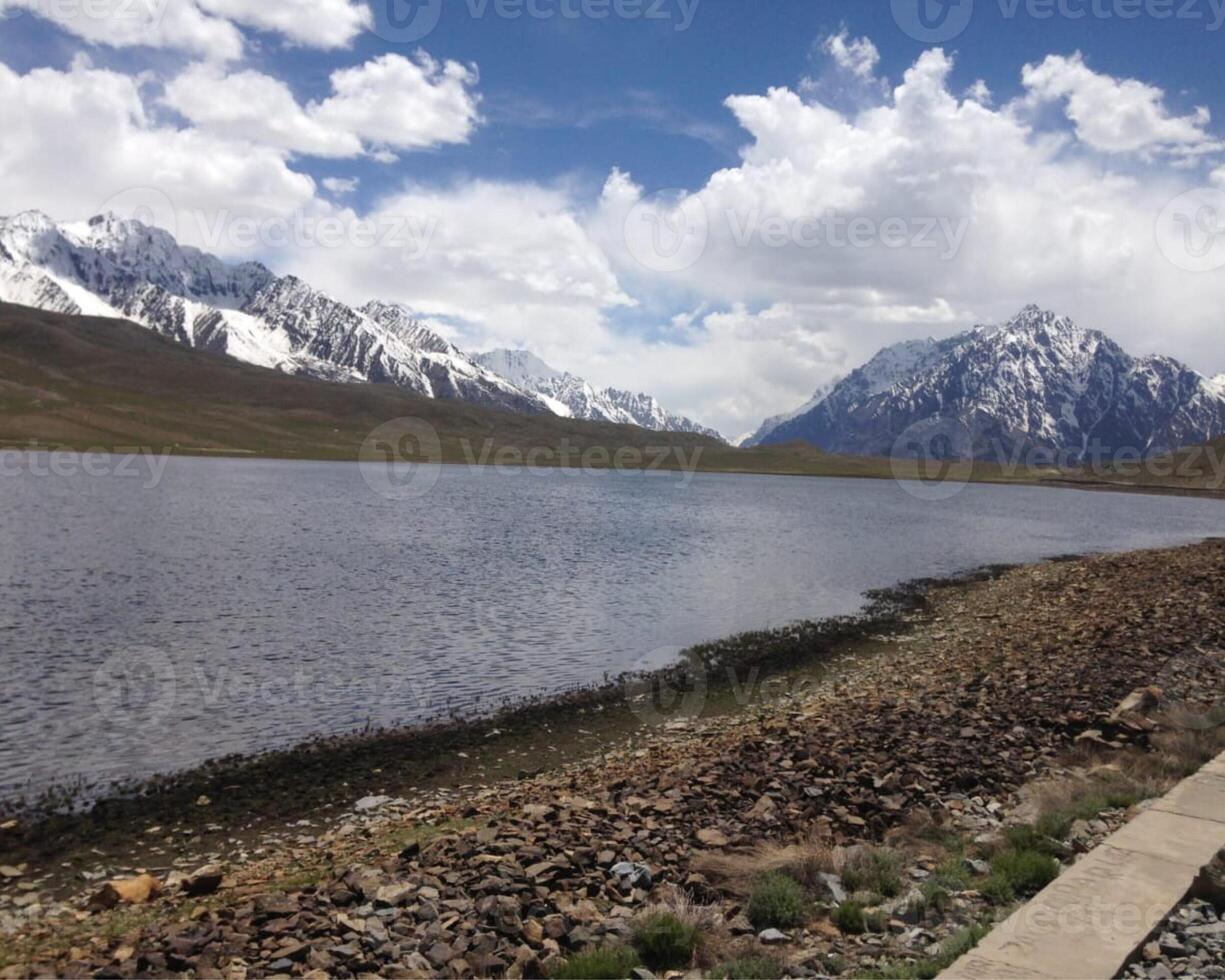 A beautiful view of lake and cloudy sky. photo
