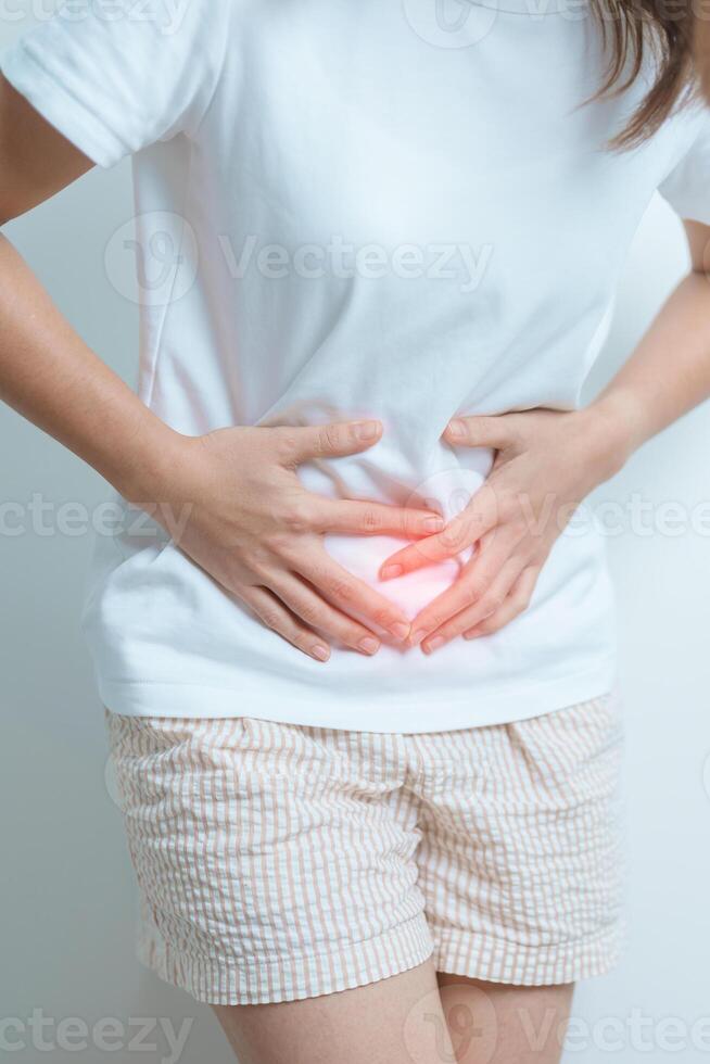 Woman having Stomach pain. Ovarian and Cervical cancer, Cervix disorder, Endometriosis, Hysterectomy, Uterine fibroids, Reproductive system, menstruation, diarrhea and Pregnancy concept photo