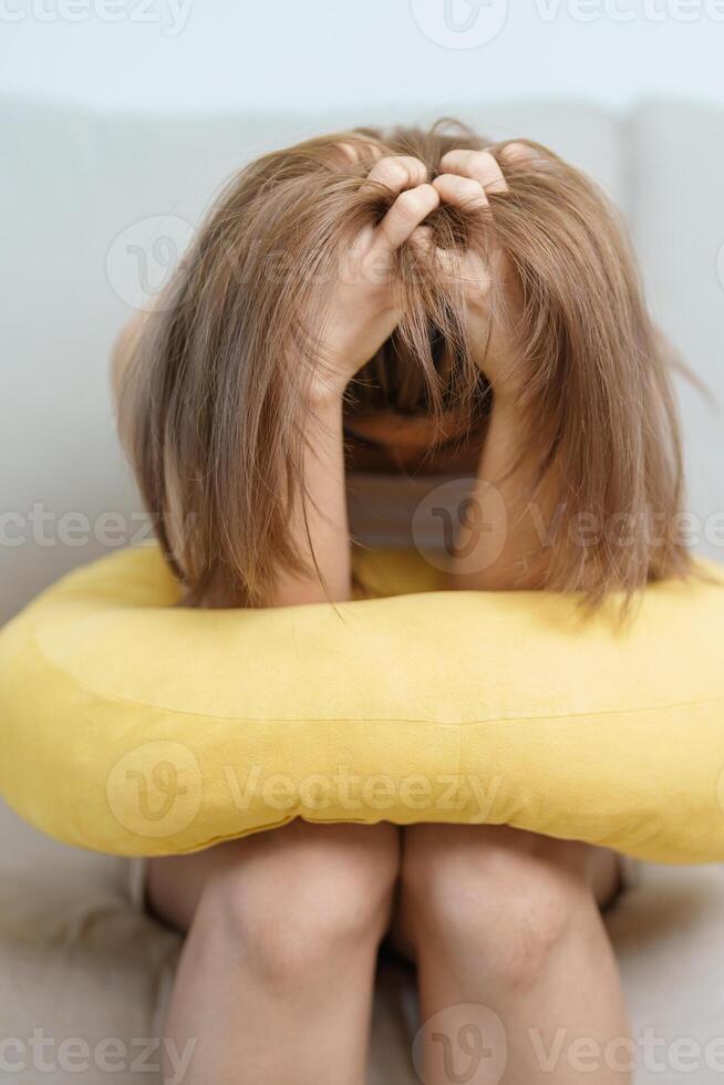 Stress, Sad and unhappy concepts. Alone asian Woman having headache, Young female feeling frustrated, exhausted and suffering photo