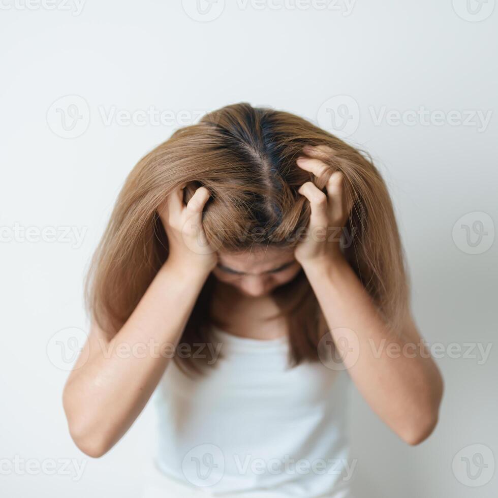 Stress, Sad and unhappy concepts. Alone asian Woman having headache, Young female feeling frustrated, exhausted and suffering photo