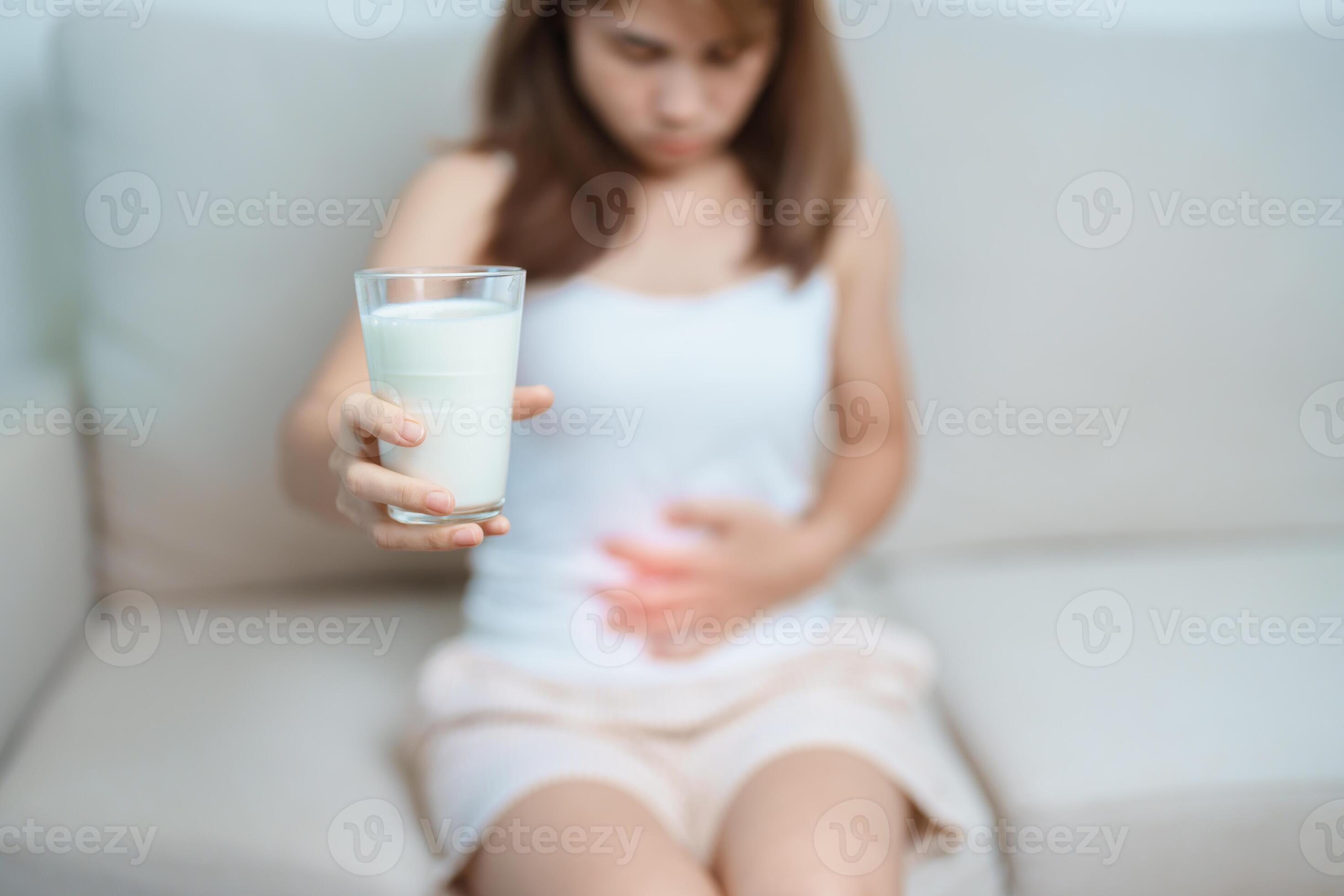 Lactose intolerance and Milk allergy concept. woman hold Milk glass and