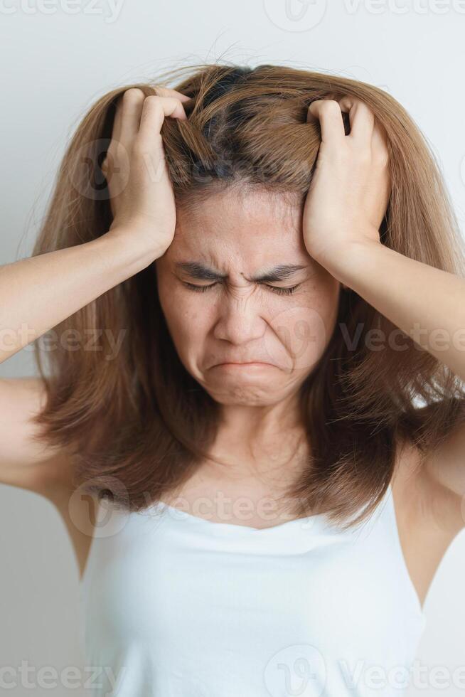 Stress, Sad and unhappy concepts. Alone asian Woman having headache, Young female feeling frustrated, exhausted and suffering photo