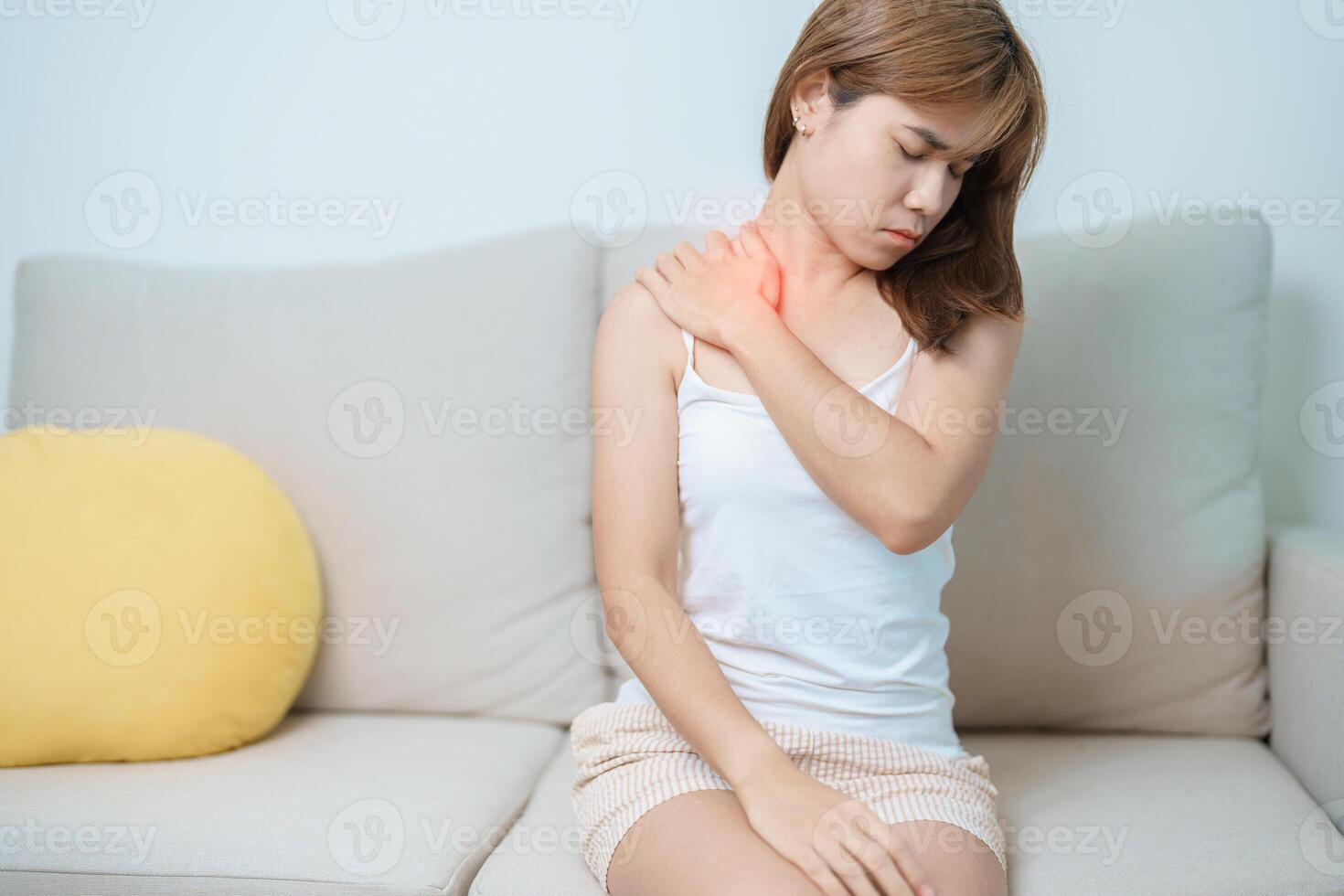 Woman having Shoulder and Neck pain at home. Muscle painful due to Myofascial pain syndrome and Fibromyalgia, rheumatism, Scapular pain, Cervical Spine. ergonomic concept photo