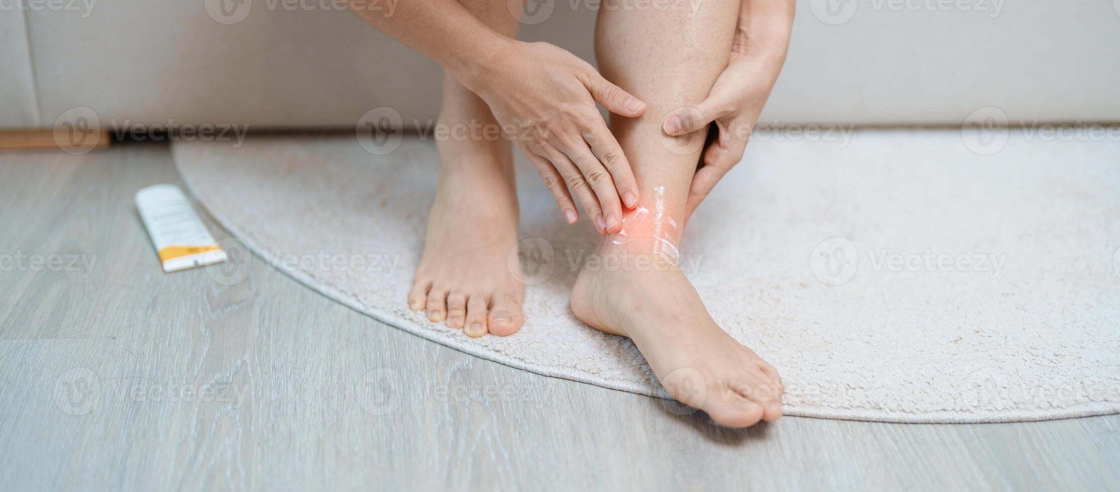 Arthritis and Muscle Pain Relief Cream concept. woman having leg pain due to Ankle Sprains or Achilles Tendonitis and Shin Splints ache. injuries, health and medical concept photo