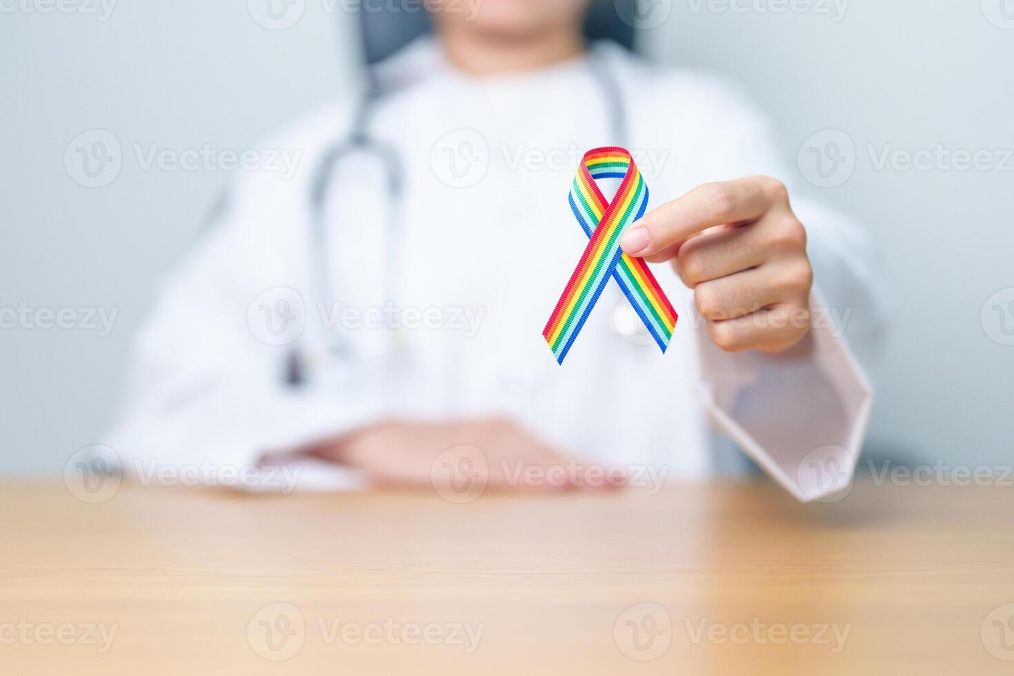 Doctor with LGBTQ Rainbow ribbon for Support Lesbian, Gay, Bisexual, Transgender and Queer community and happy Pride month concept photo
