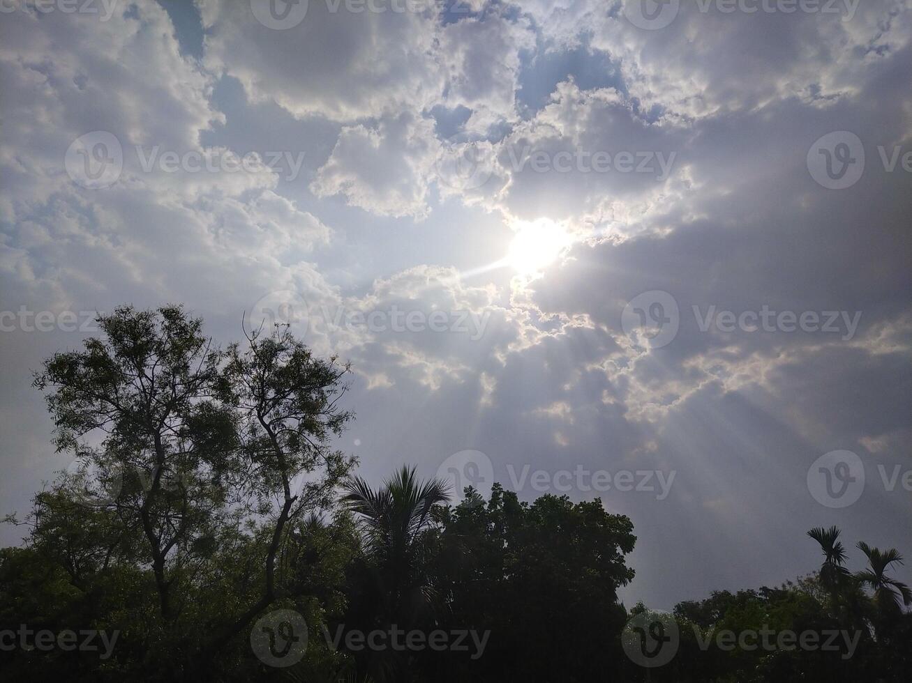 The light from the sun shining through the clouds. photo