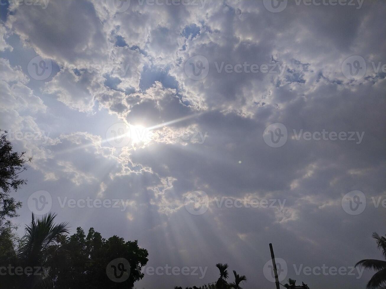 The light from the sun shining through the clouds. photo