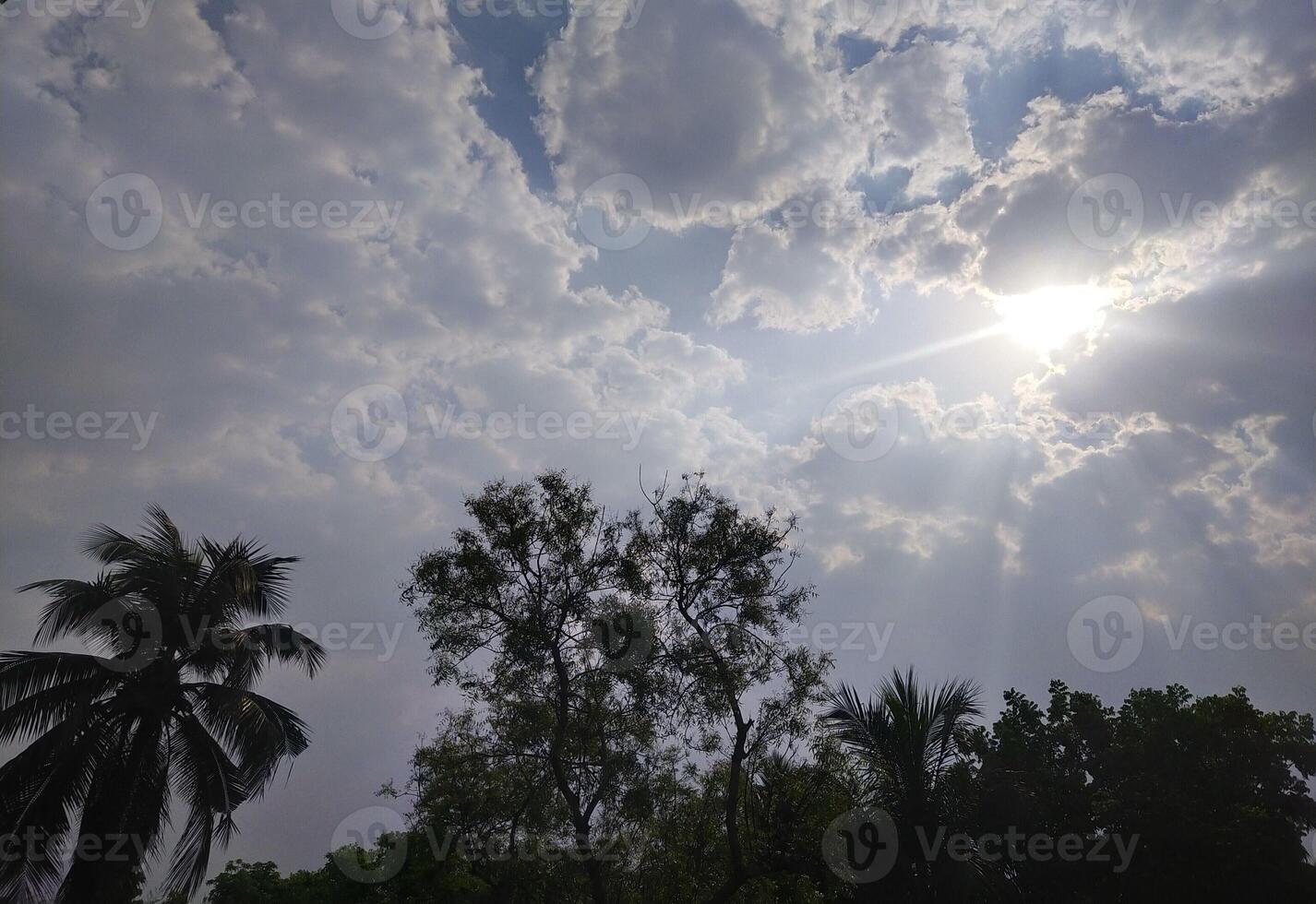 The light from the sun shining through the clouds. photo