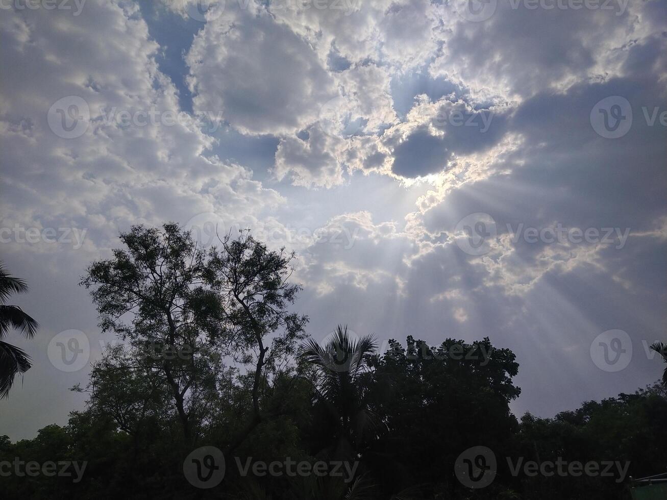 The light from the sun shining through the clouds. photo