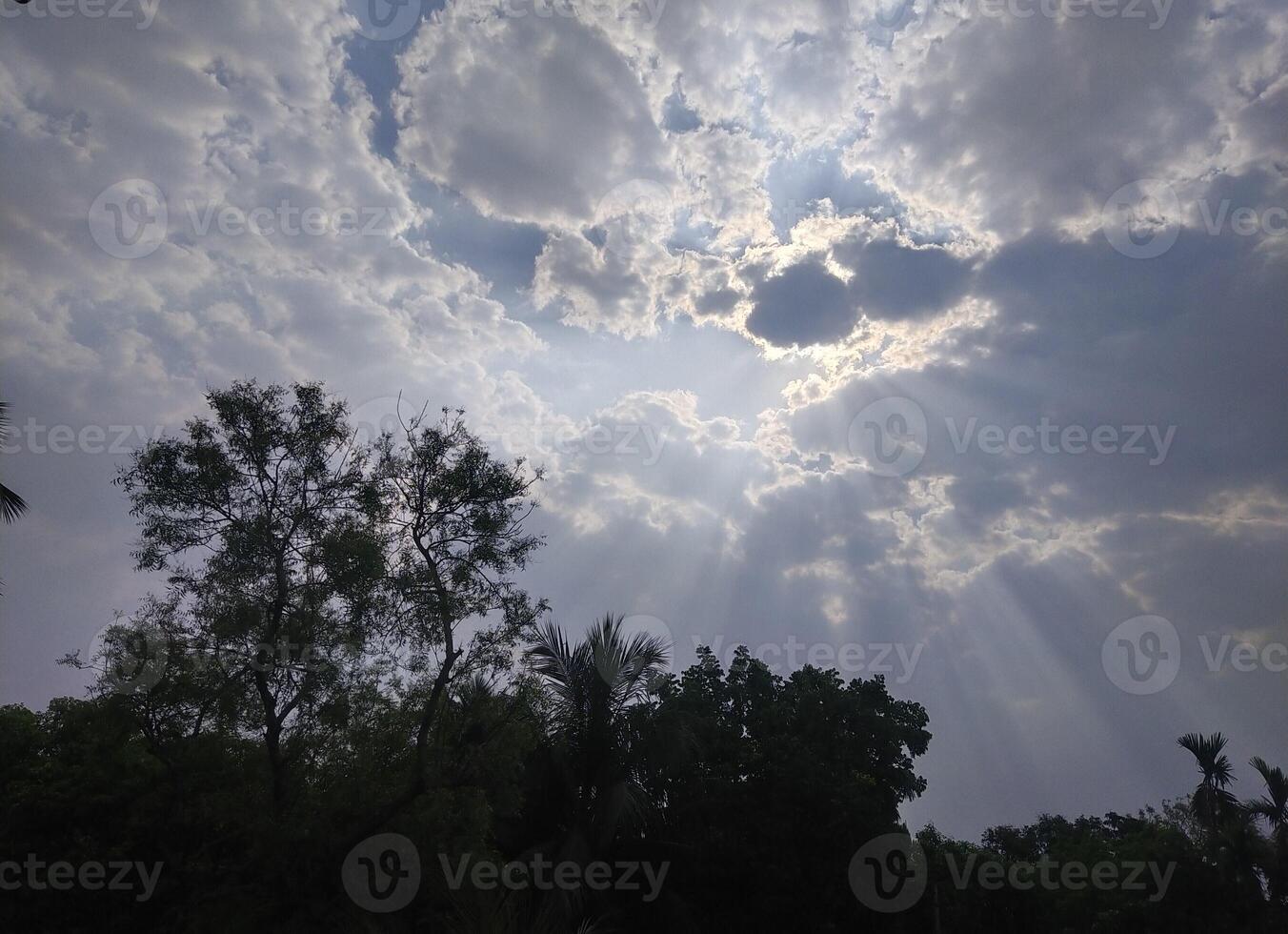 The light from the sun shining through the clouds. photo