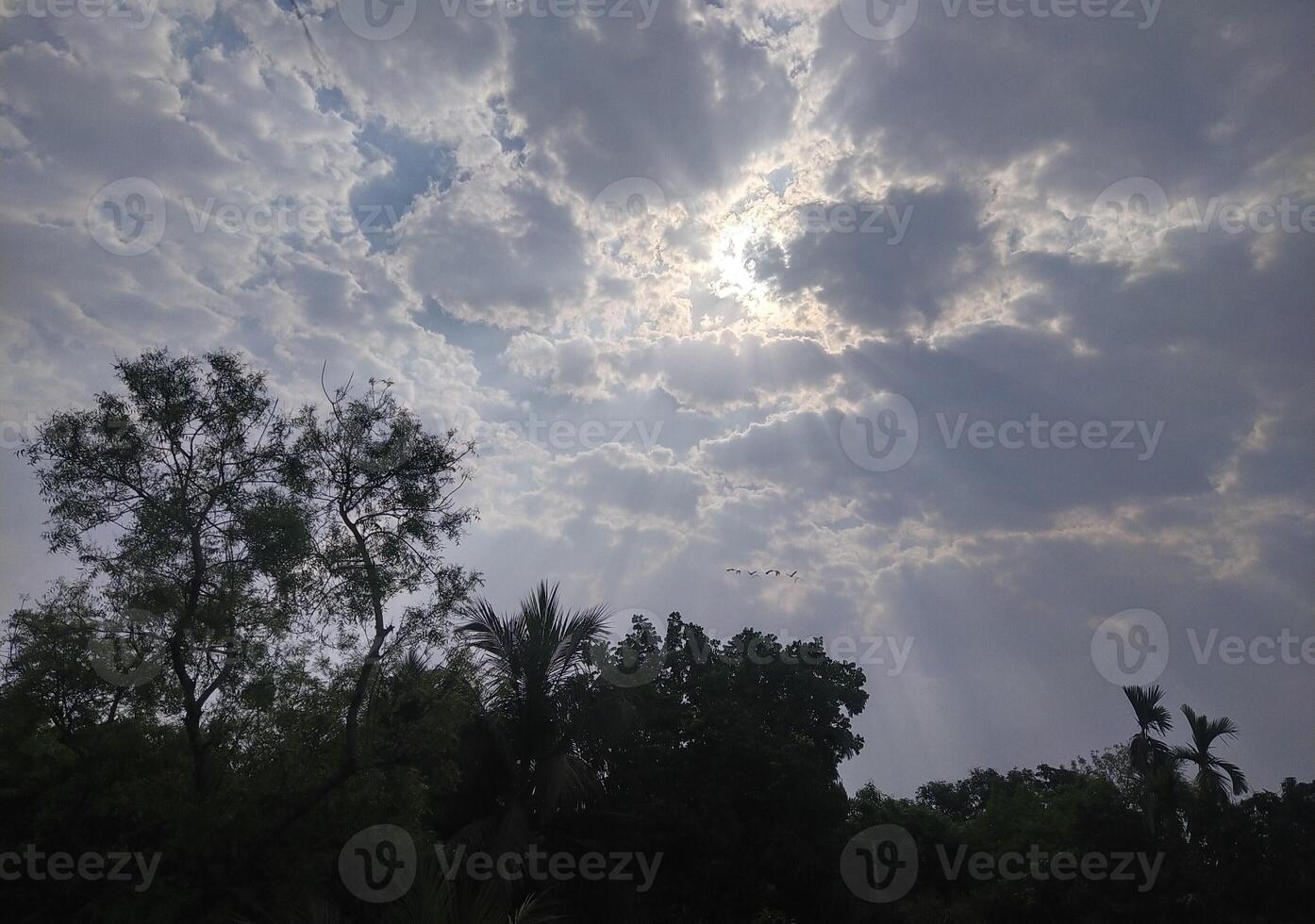 The light from the sun shining through the clouds. photo