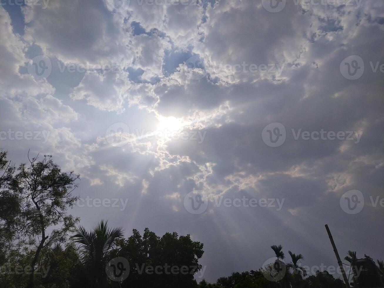 The light from the sun shining through the clouds. photo