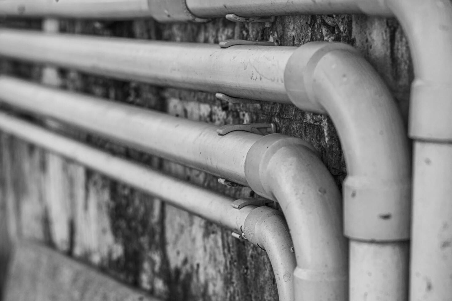 PVC plumbing pipes arranged beautifully. This picture is black and white. photo