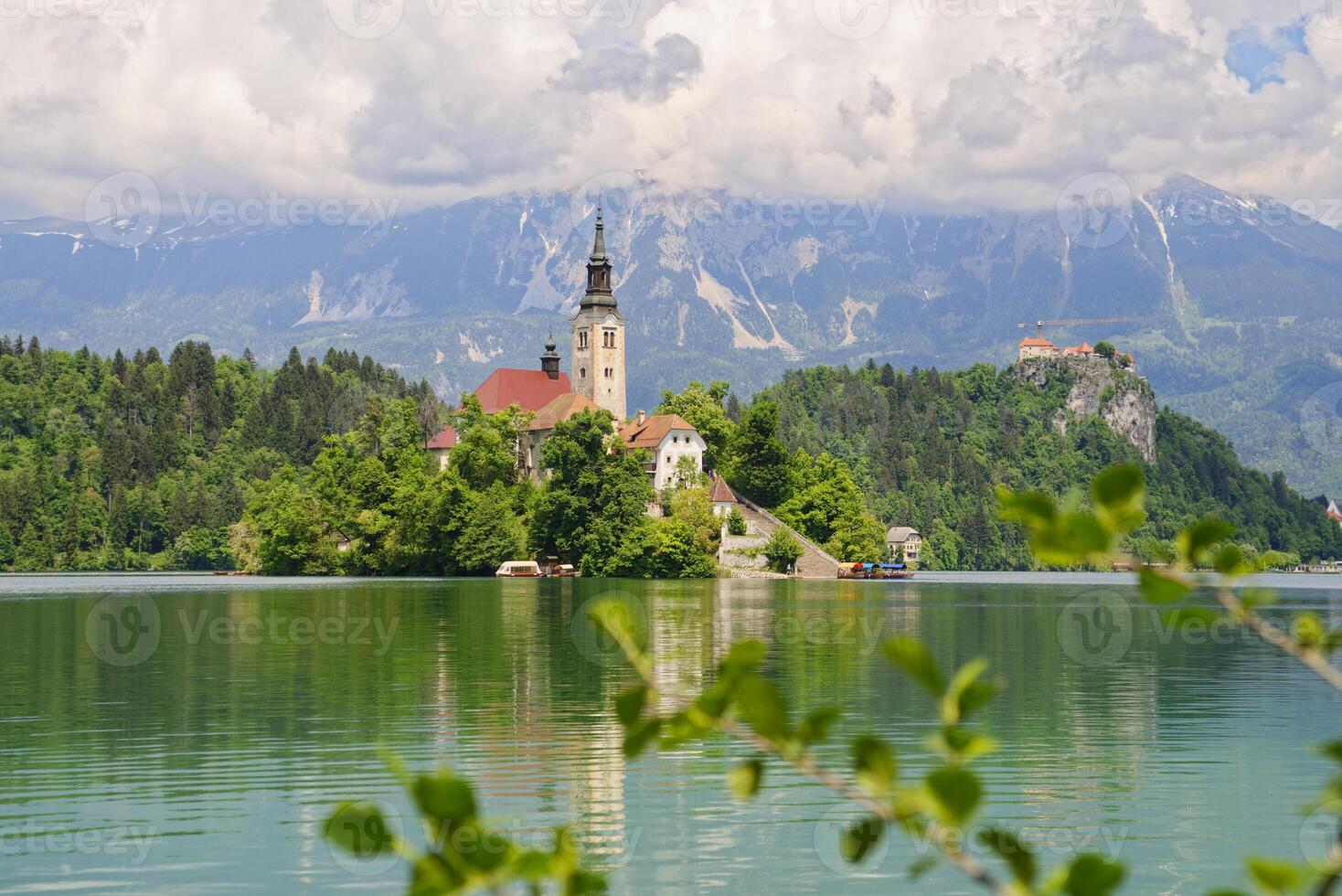 View of the magical Lake Bled in Slovenia. Church of the Mother of God on a little Island in the lake. photo