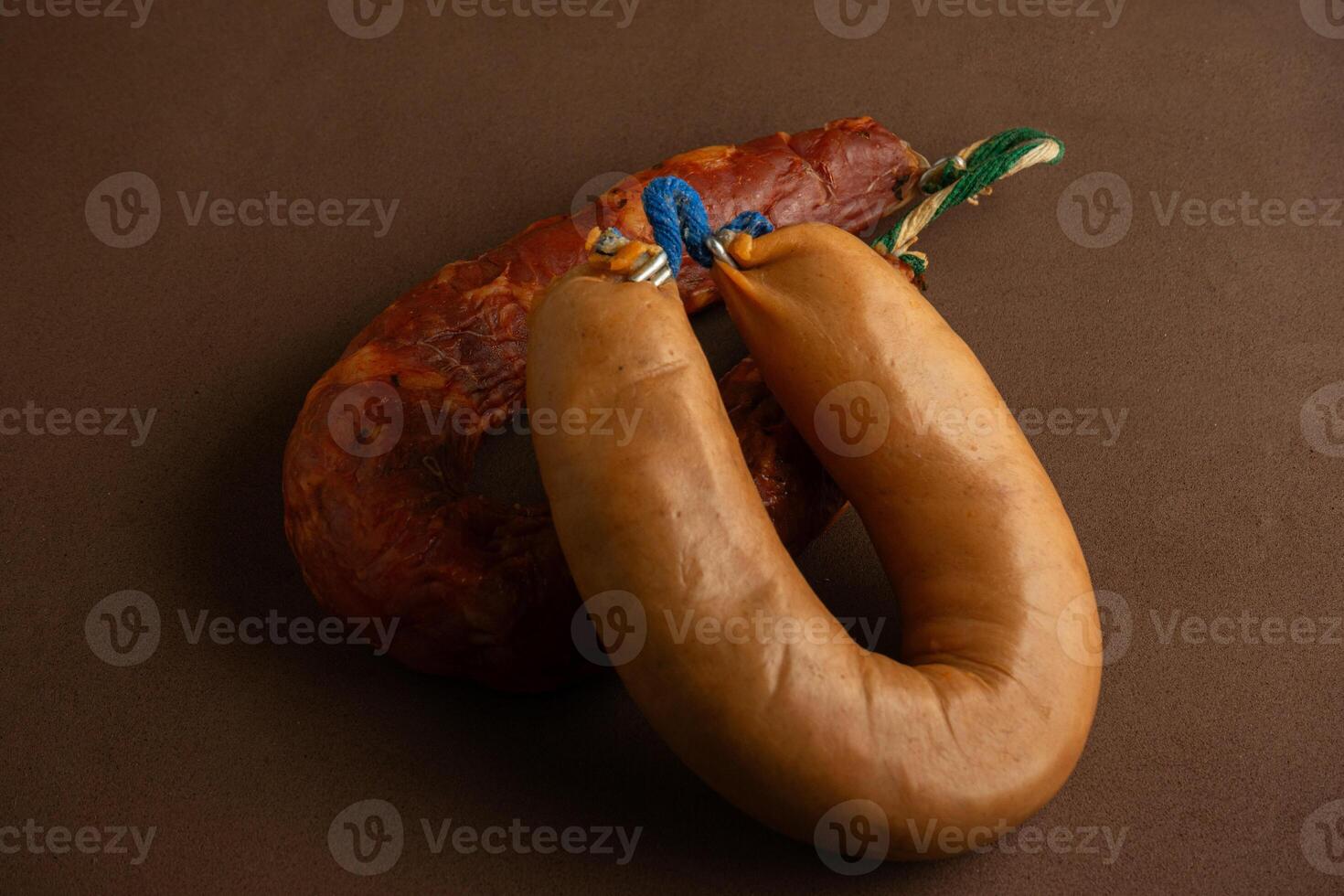 Traditional Alentejo sausages - linguica and farinheira - on a rustic brown background. photo