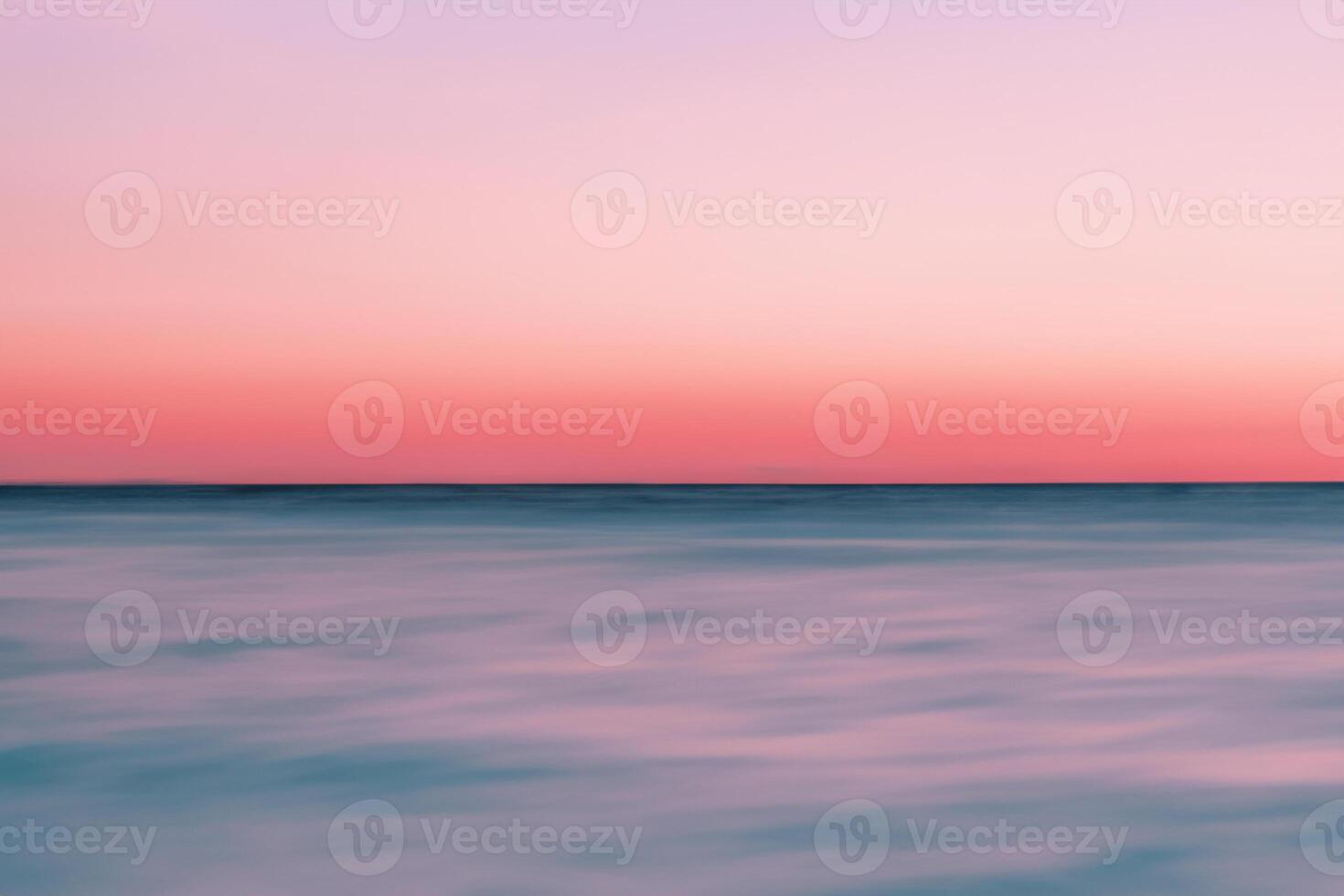 Serene Beachscape, Mirroring Soft Sand, Tropical Blur, and Abstract Sunset Sky. photo