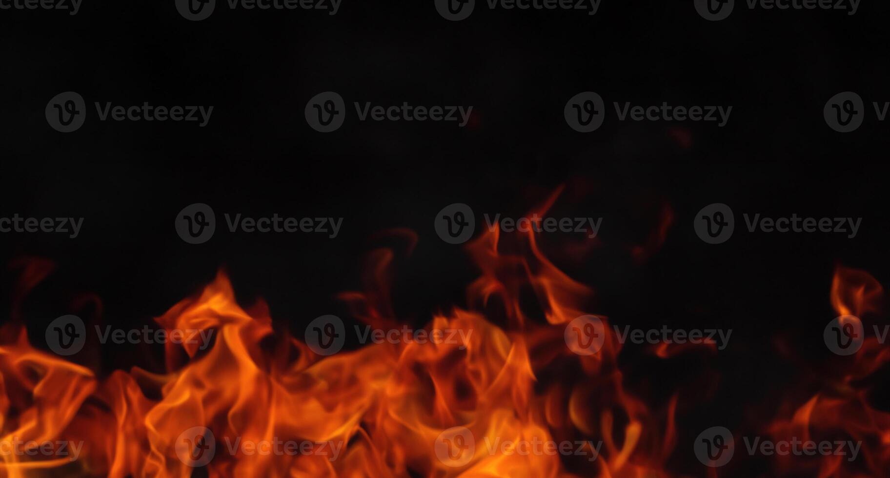 Intense Flames on a Dark Canvas, Fiery Black Background. photo