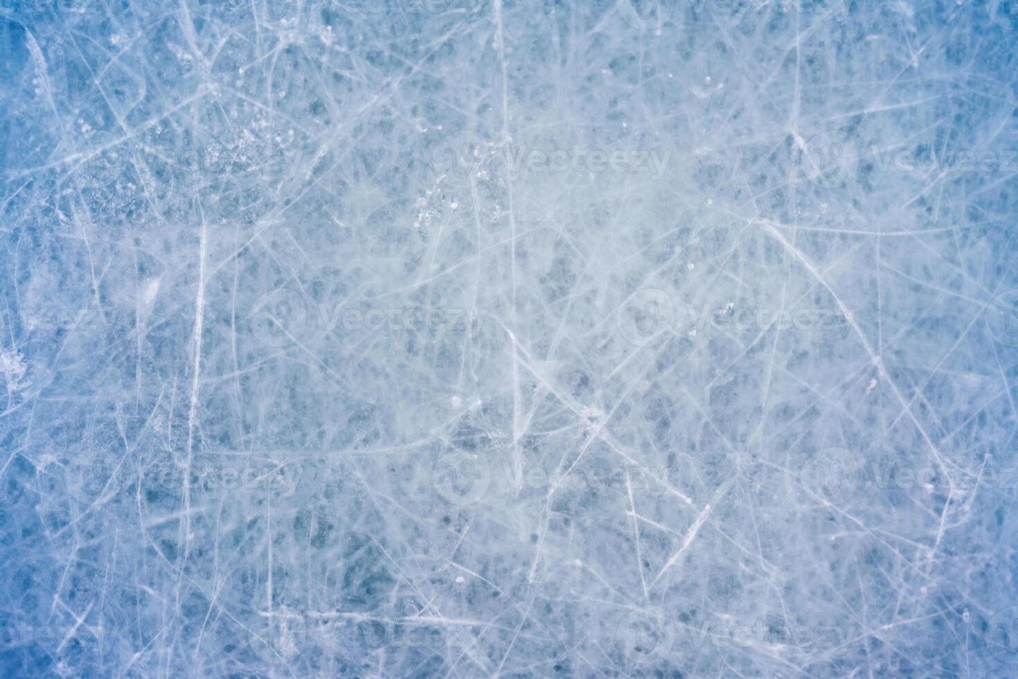 Icy Canvas, Abstract Patterns of Skating and Hockey Marks on Blue Rink Surface Texture. photo