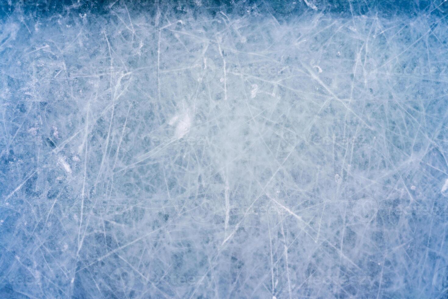 Icy Canvas, Abstract Patterns of Skating and Hockey Marks on Blue Rink Surface Texture. photo