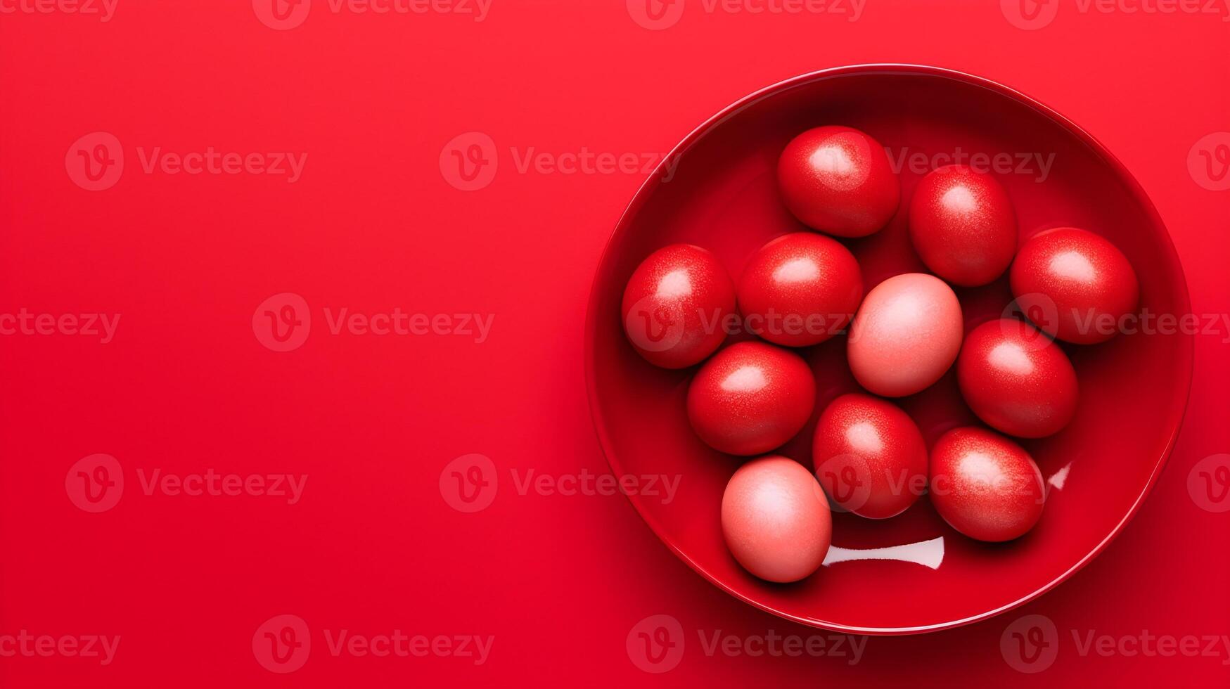 A bowl of colorful eggs with copyspace on red background. Easter egg concept, Spring holiday photo